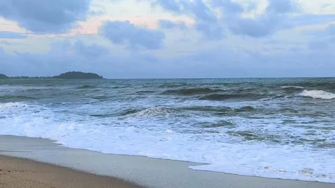 Waves of Rusila Beach, Terengganu Rolling Under Cloudy Skies in a Serene Coastal Stock Footage 325614331