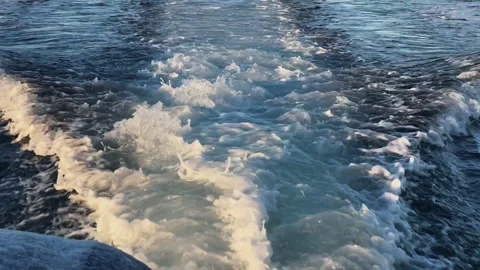 Waves from a sailing yacht in the sun Stock Footage 219627490