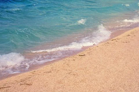 Waves on  sand beach, background. Adriatic Sea, Montenegro Stock Photos