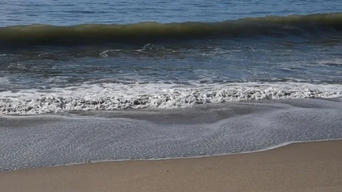 Waves on the sand Stock Footage 100990167