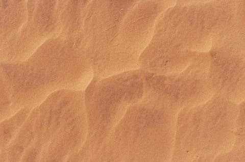 Waves of sand pattern in hot desert Stock Photos