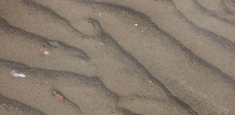 Waves on sand Stock Photos