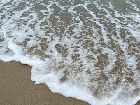 Waves on the sand Foto stock