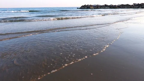 Waves on Sandy Beach Background at Sunrise or Sunset Stock Footage 120942117