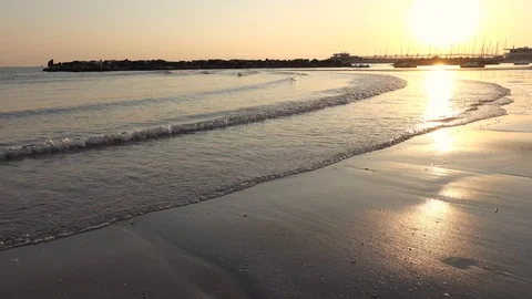 Waves on Sandy Beach Background at Sunrise or Sunset Stock Footage 120942145