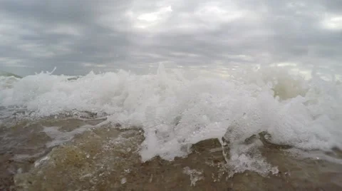 Waves on sandy beach. The beach on the shores of sea. Waves wash chamber Stock Footage 52342899