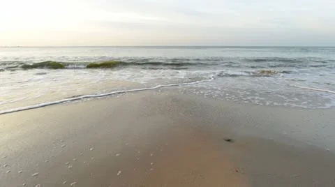 Waves on a sandy beach Stock Footage 10579171