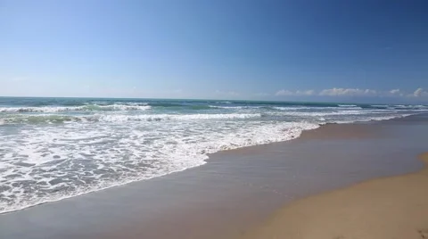 Waves on a sandy beach Stock Footage 55578653