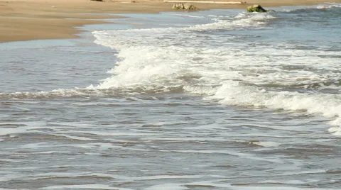 Waves on a sandy beach. Stock Footage 59942650