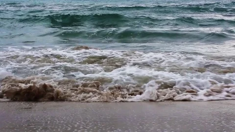 Waves in the sandy beach Video stock 71239412