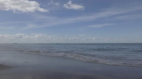 Waves on a sandy beach. Stock Footage 75711464