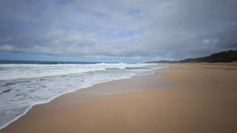 Waves on a sandy beach Stock Footage 303137065