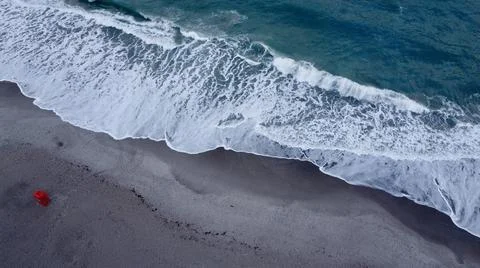 Waves at a sandy beach Foto stock