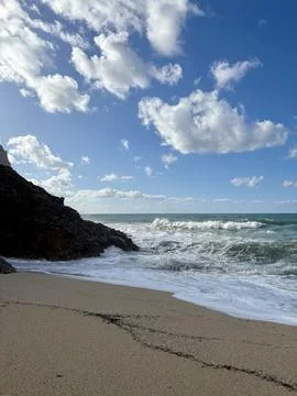 Waves sandy beach Stock Photos