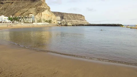 Waves on the sandy beach in Puerto de Mogan Gran Canaria Spain Video stock 86105215
