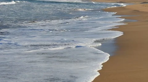 Waves on sandy beach. Slow motion Stock Footage 56695531