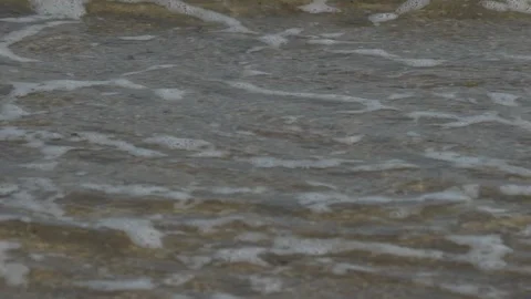 Waves at a sandy beach in summer, no color grading, slowmotion Stock Footage 286061481