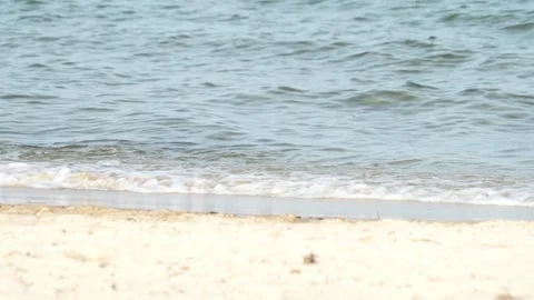 Waves at a sandy beach in summer, no color grading, slowmotion Stock Footage 286061635