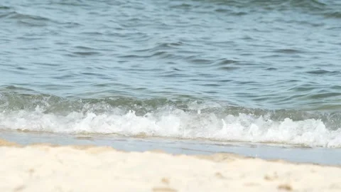 Waves at a sandy beach in summer, no color grading, slowmotion Stock Footage 286061672