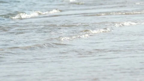 Waves at a sandy beach in summer, no color grading, slowmotion Stock Footage 286061749