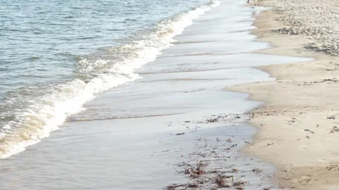 Waves at a sandy beach in summer, no color grading, slowmotion Stock Footage 286061750