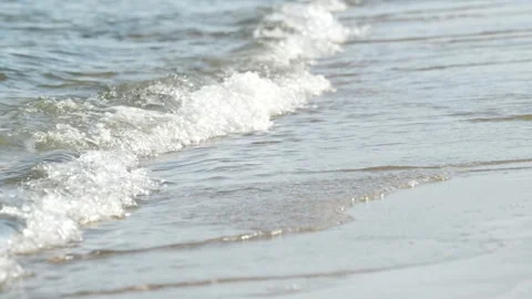 Waves at a sandy beach in summer, no color grading, slowmotion Stock Footage 286061772