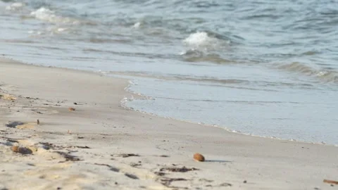 Waves at a sandy beach in summer, no color grading, slowmotion Stock Footage 286061809