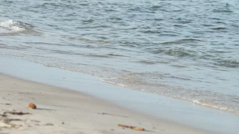 Waves at a sandy beach in summer, no color grading, slowmotion Stock Footage 286061881