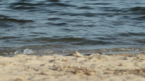 Waves at a sandy beach in summer, no color grading, slowmotion Stock Footage 286061882