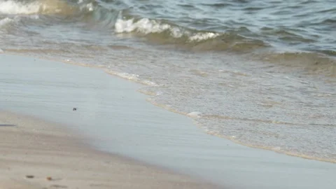 Waves at a sandy beach in summer, no color grading, slowmotion Stock Footage 286061902