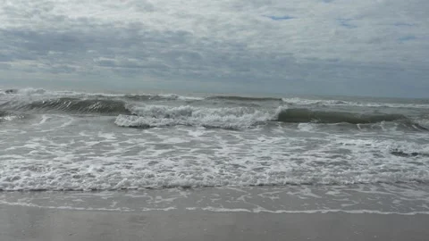 Waves at a sandy beach in summer, no color grading, slowmotion Stock Footage 286061962
