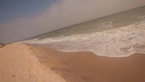 Waves on the sandy beach in sunny summer weather Video stock 112322922