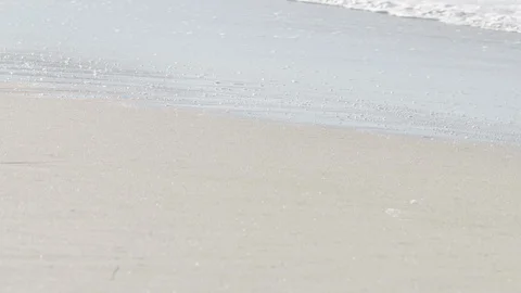 Wave's scum advancing on the beach, Hossegor, France Stock Footage 105313129
