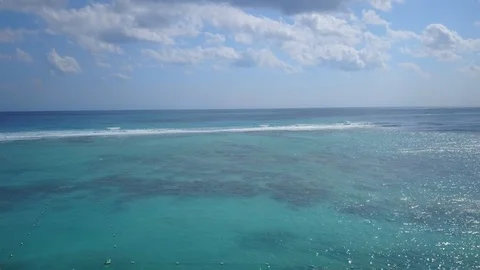 Waves in the sea and cloud shadows moving in | 4k Drone Stock Footage 100263537