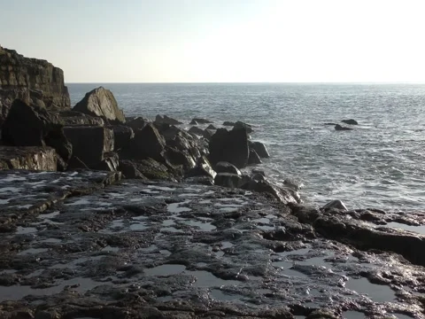Waves of the sea and the stone coast. Stock Footage 73956832
