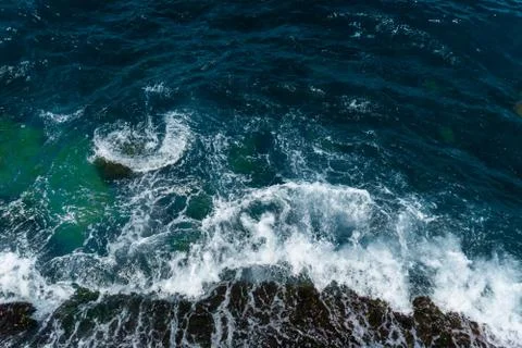 The waves in the sea background blue Stock Photos