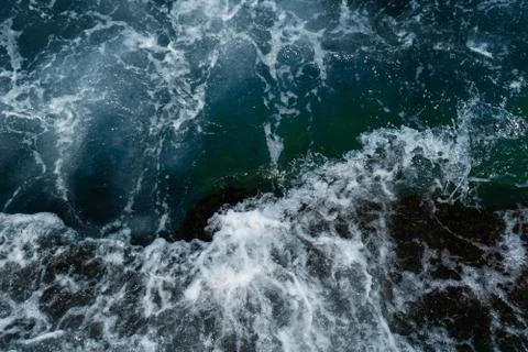The waves in the sea background blue Stock Photos