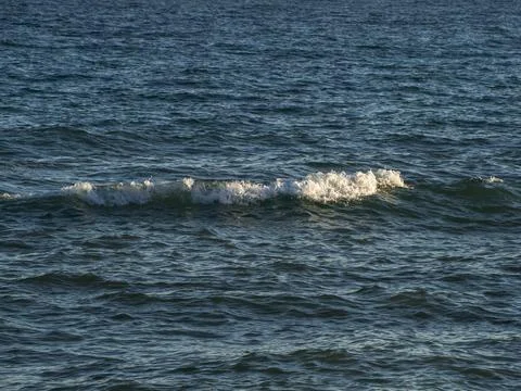 Waves on the sea beach Stock Photos