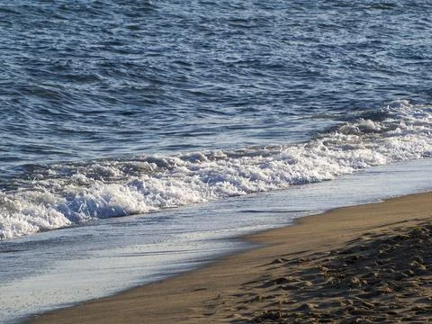 Waves on the sea beach Stock Photos