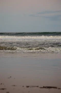 Waves in the sea with blue sky as background Stock Photos