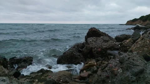 Waves of the sea break on the rocks 스톡 동영상 247524989