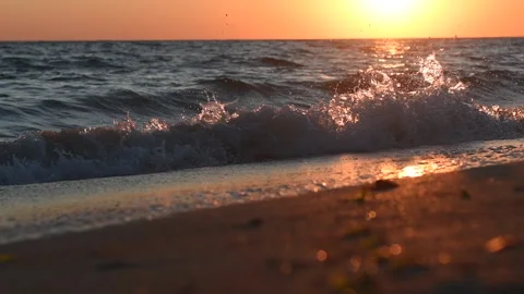 Waves on the sea coast at sunset. Stock Footage 139138848
