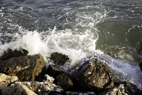Waves at sea colliding with rocks, vacations and summer Stock Photos