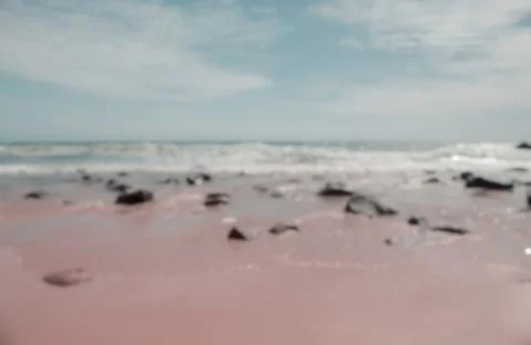 The waves of the sea crashed into the shore Stock Photos