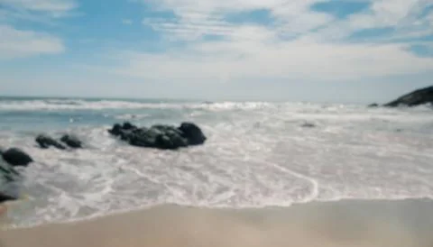 The waves of the sea crashed into the shore Stock Photos