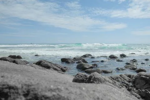 The waves of the sea crashed into the shore Stock Photos