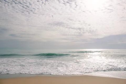 The waves of the sea crashed into the shore Stock Photos