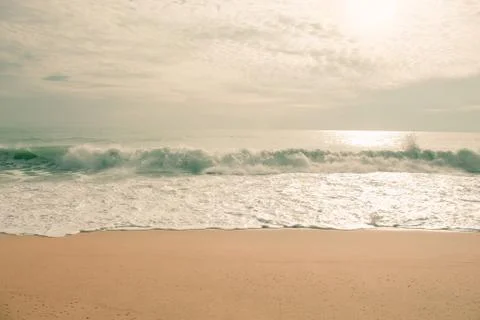 The waves of the sea crashed into the shore Stock Photos
