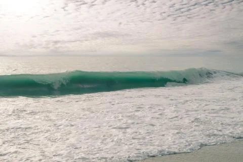 The waves of the sea crashed into the shore Stock Photos