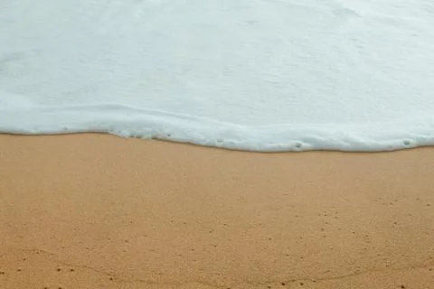 The waves of the sea crashed into the shore Stock Photos